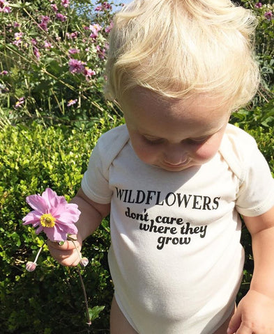 WILDFLOWERS DON'T CARE WHERE THEY GROW